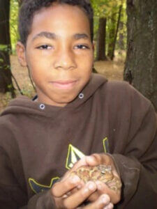 kid holding turtle